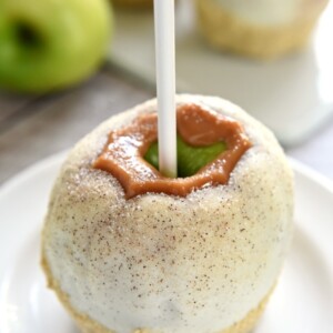 Apple Pie Caramel Apples {Disney Copycat Recipe} ~ tart Granny Smith apples are dipped in chewy caramel, coated in white chocolate, sprinkled with cinnamon sugar, and then finished off with pie crust crumbs for your favorite Disney treat easily made at home for a fraction of the price! | FiveHeartHome.com for LilLuna.com
