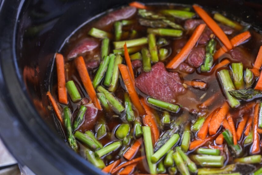 Mongolian beef and vegetables cooking in the crock pot.