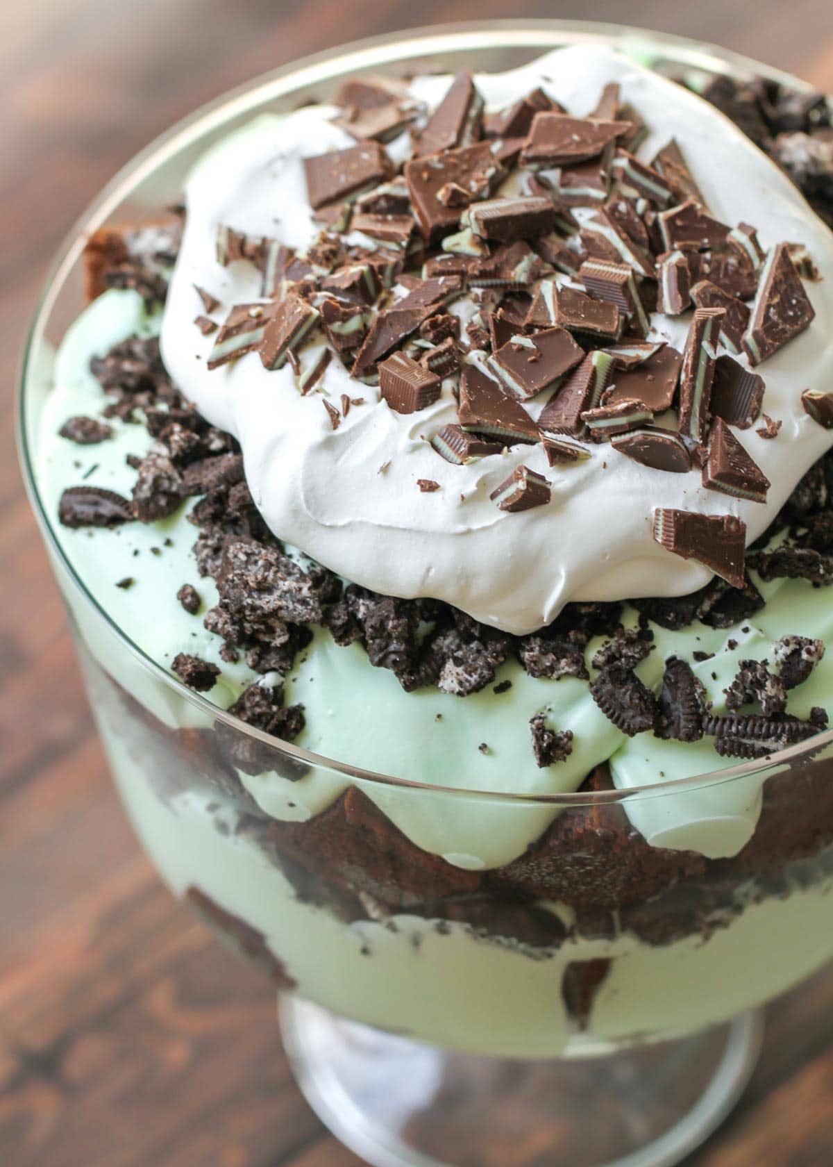 Anded mint trifle recipe topped with whipped cream and andes mints