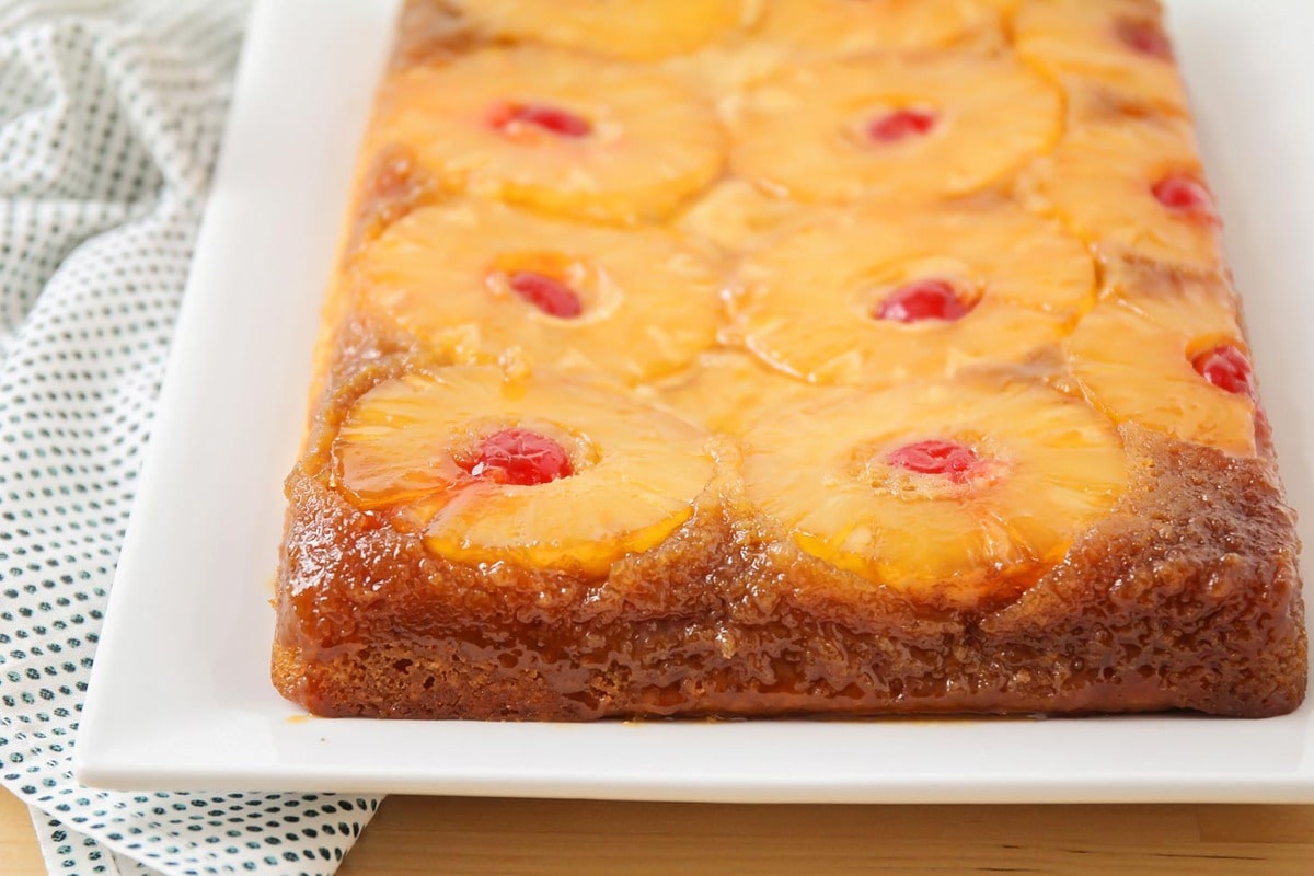 Pineapple upside down cake on white plate