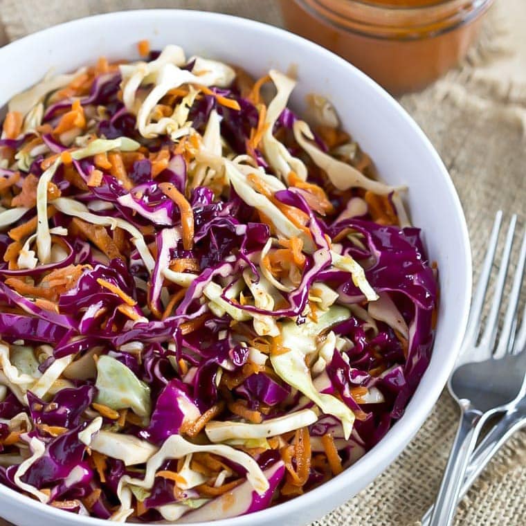 Sweet and Tangy Coleslaw in a white bowl.