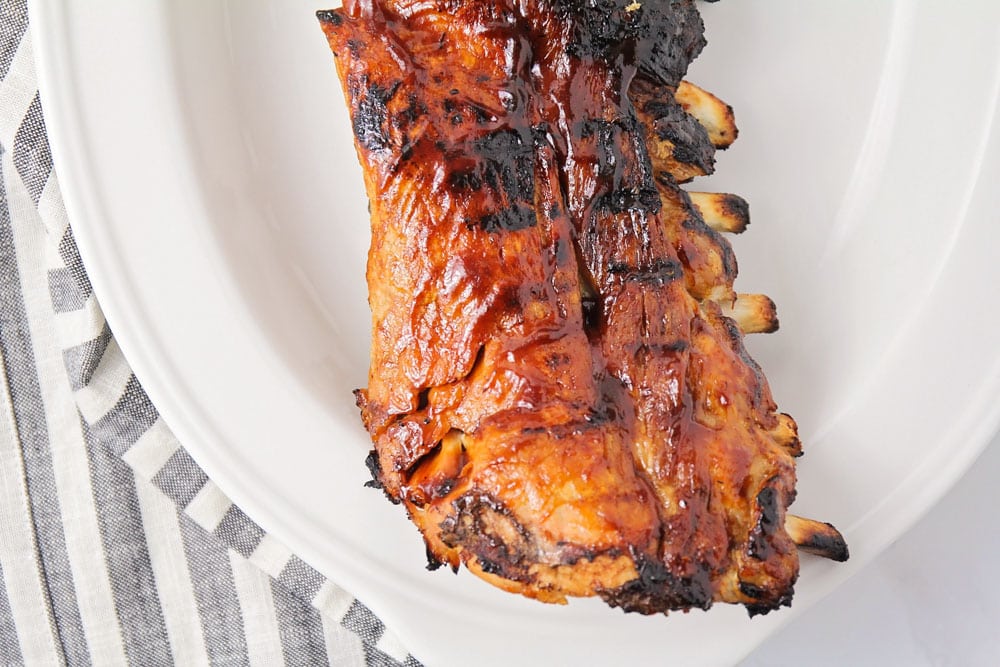 Easy Dr. Pepper ribs served on a white platter.