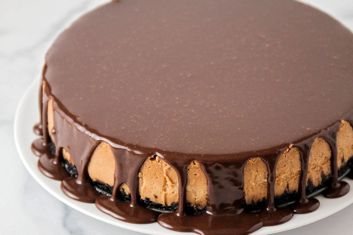 Chocolate ganache on top of chocolate cheesecake.