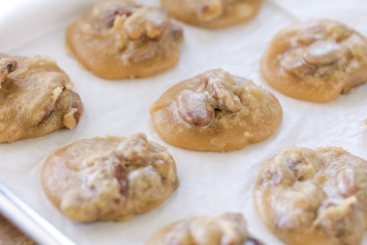 Pecan pralines on a wax paper lined baking sheet