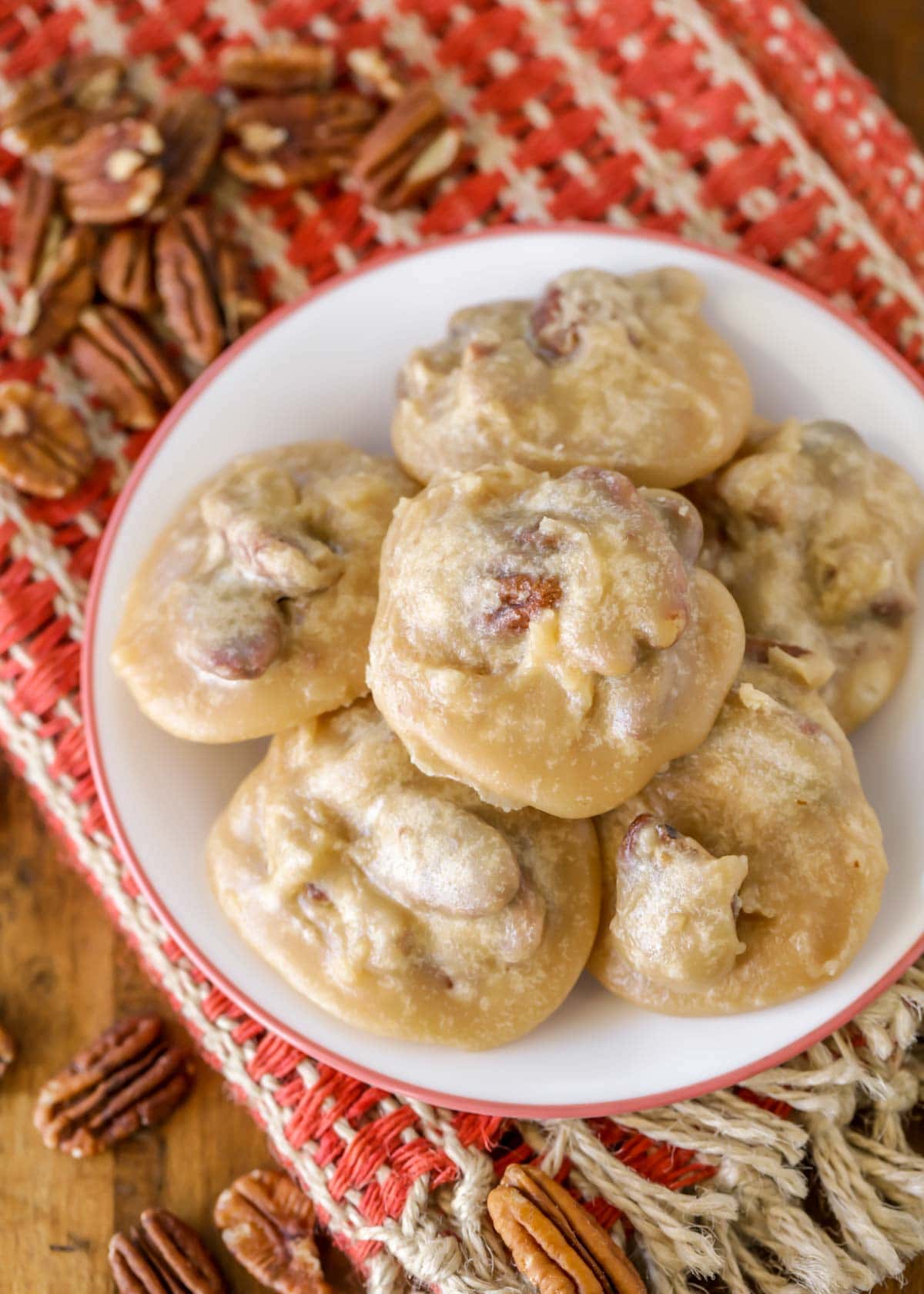 candied pecan pralines on a white plate