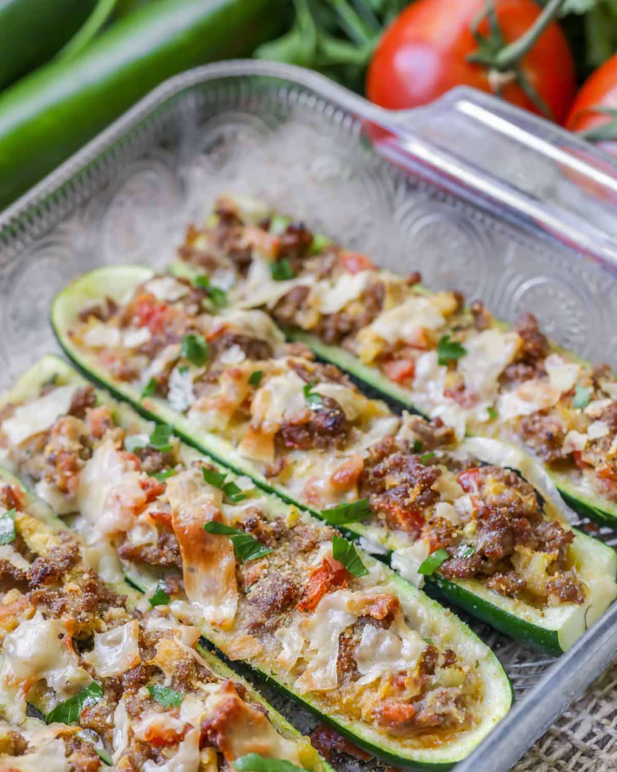 Stuffed Zucchini Boats baked in a glass dish.