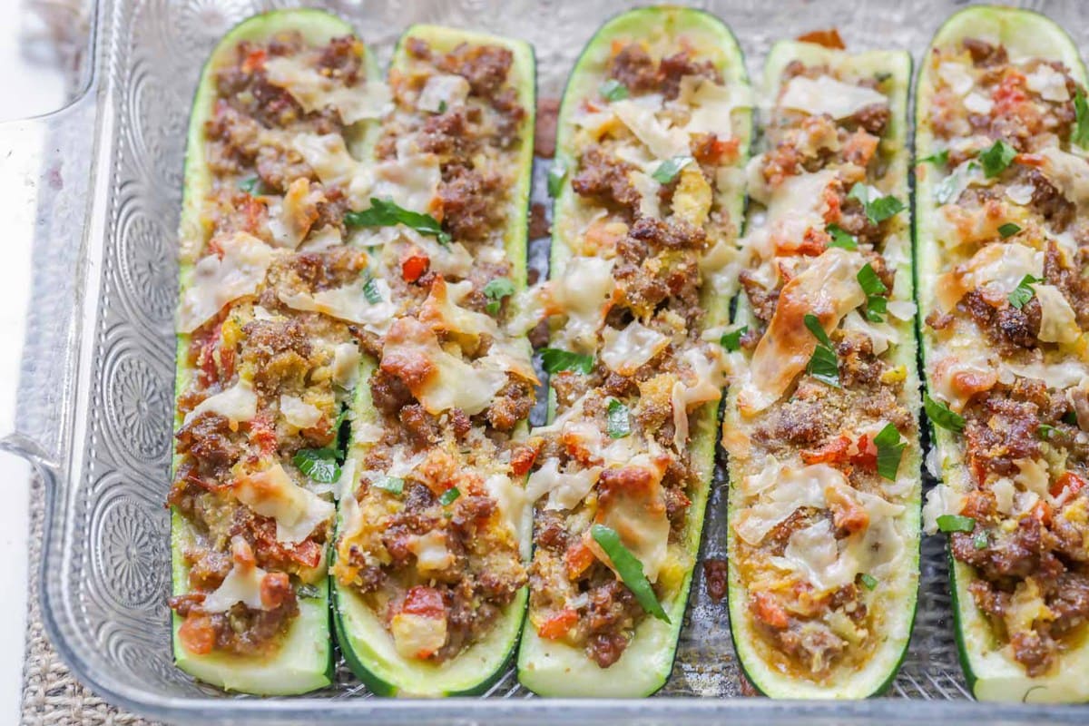 Zucchini Boats served in a glass baking dish.