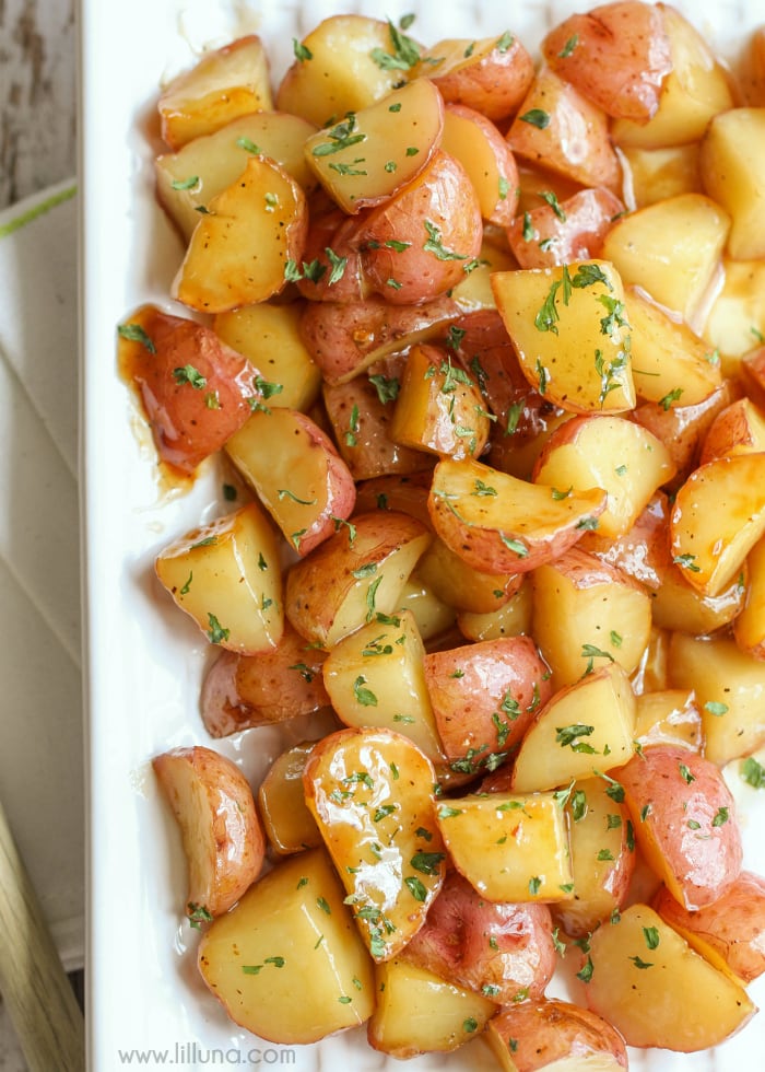 Easy side dishes - brown sugar glazed red potatoes topped with fresh herbs.