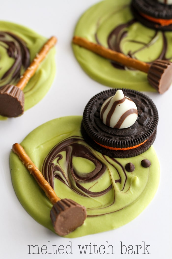 Melted Witch Bark - a cute and fun Halloween treat everyone will love! { lilluna.com } All you need to make these fun treats are - green candy melts, mini chocolate chips, pretzel sticks, mini reeses, Halloween oreos, and Hershey Hugs!
