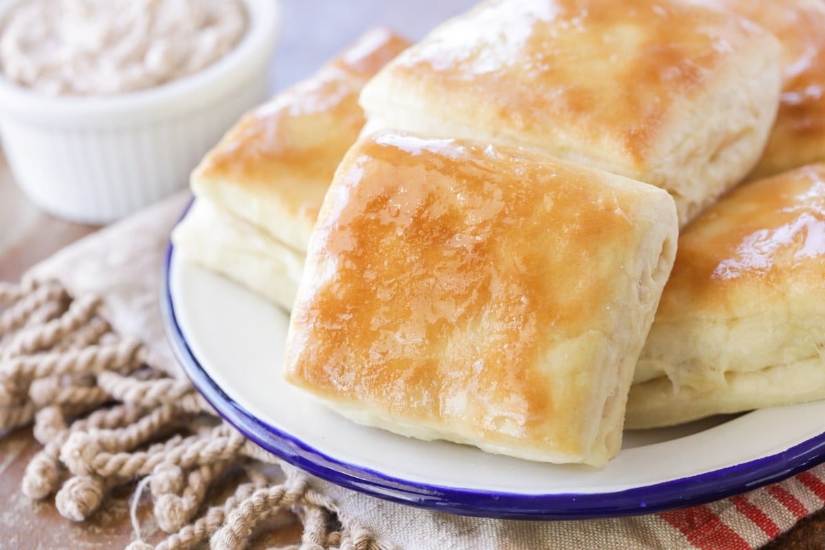 Halloween dinner ideas - piled copycat Texas roadhouse rolls served with cinnamon butter.