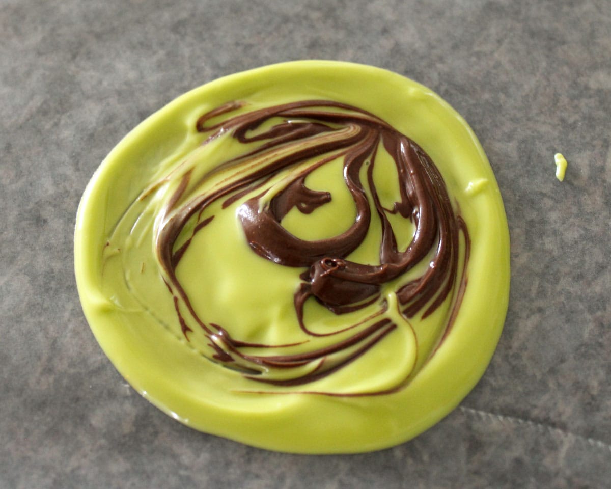 Green and brown chocolate swirls in a circle.