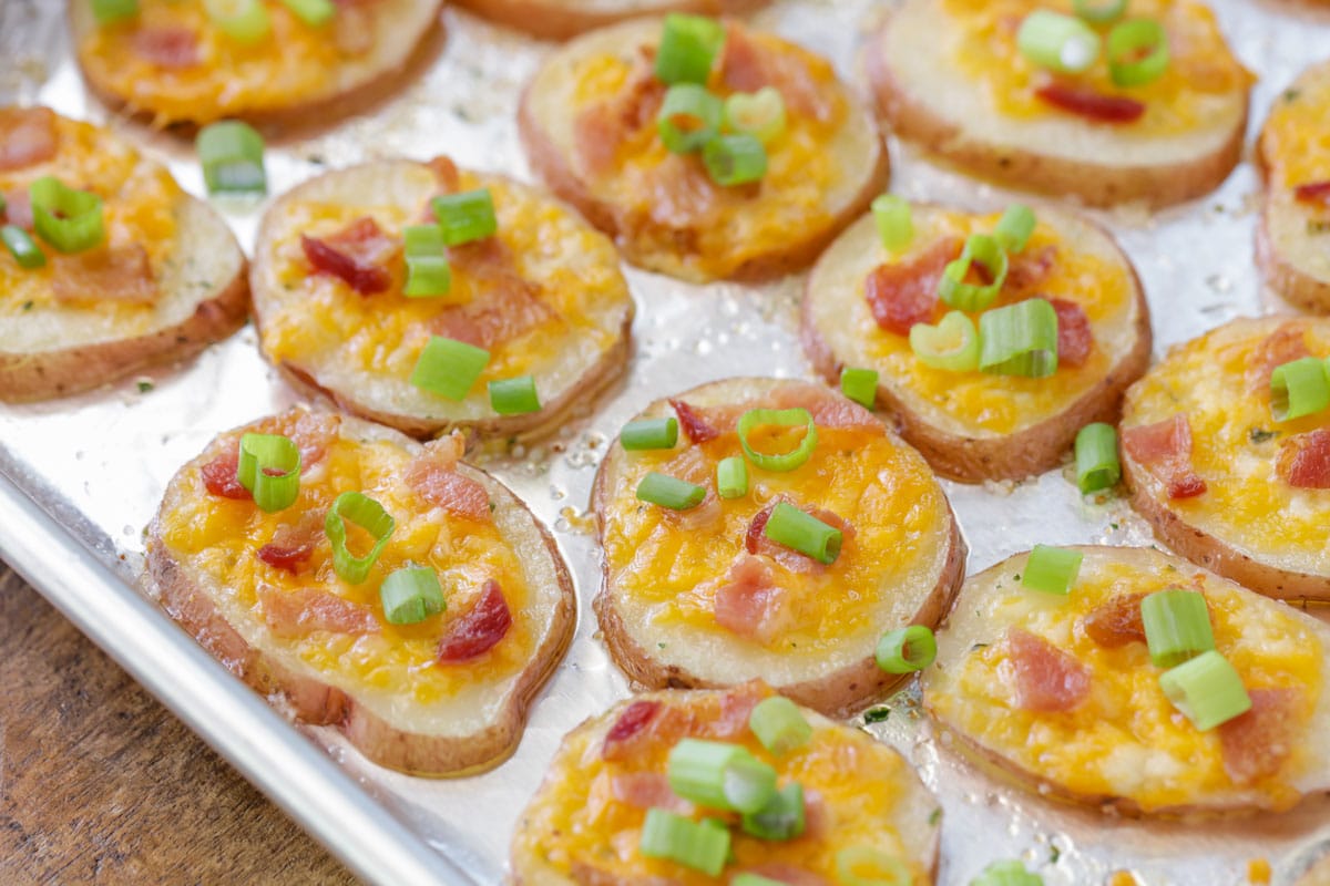 Super Bowl Appetizers - Loaded Baked Potato Rounds on a metal baking tray. 