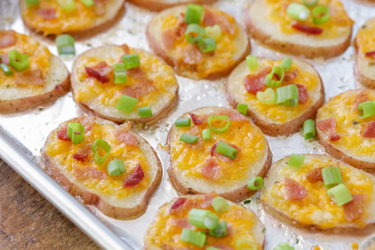 Baked potato rounds on a metal baking sheet