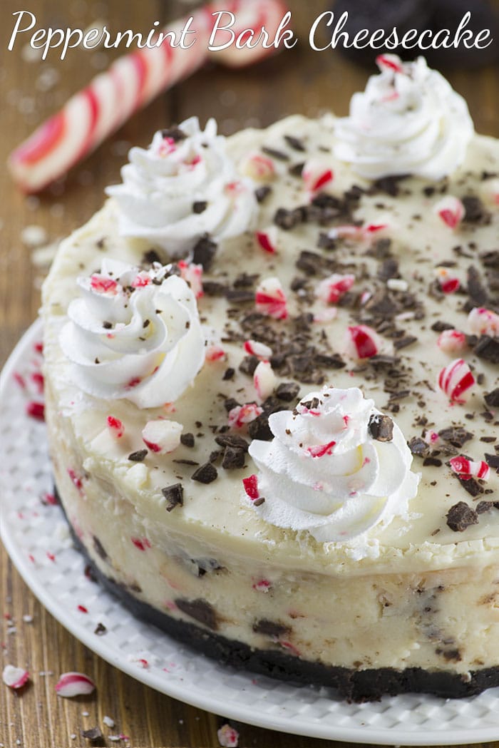 Peppermint Bark Cheesecake - It has three delicious layer-Oreo crust, creamy cheesecake filling loaded with peppermint bark pieces and white chocolate ganache on top garnished with crushed candy canes, whipped cream and chocolate.