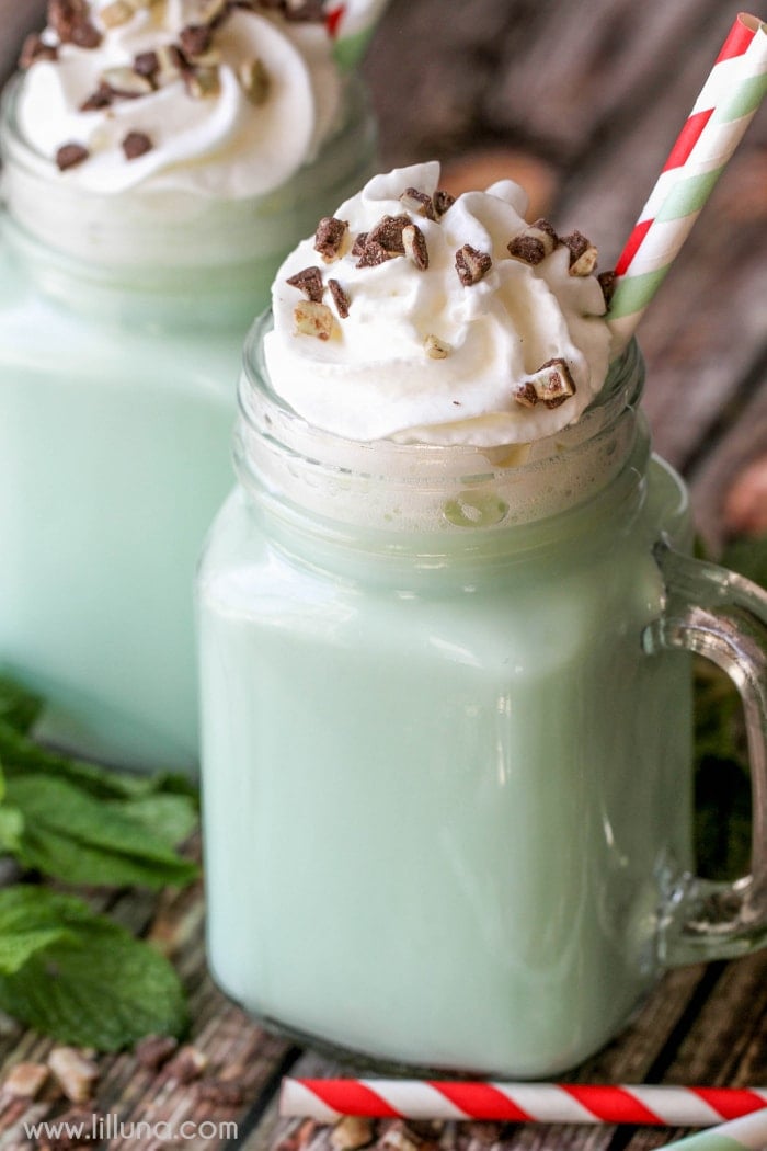 two glass mugs filled with mint hot cocoa