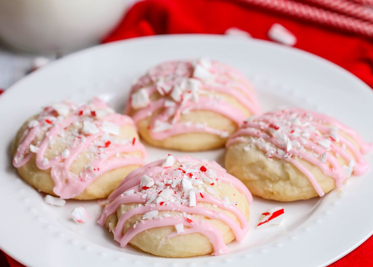 Christmas desserts - 4 peppermint meltaways drizzled with pink icing.