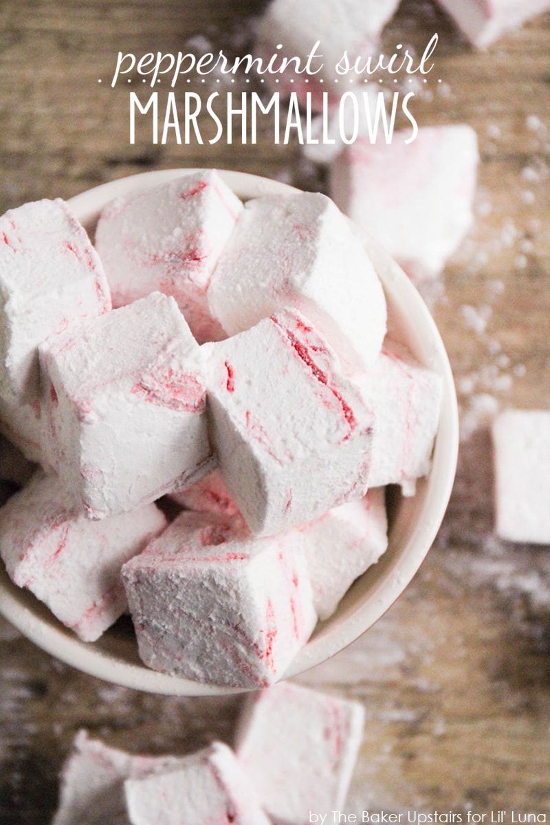 Peppermint swirl marshmallows cut into cubes in a white mug