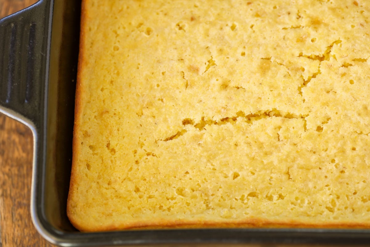 cooked sweet cornbread in a glass baking dish