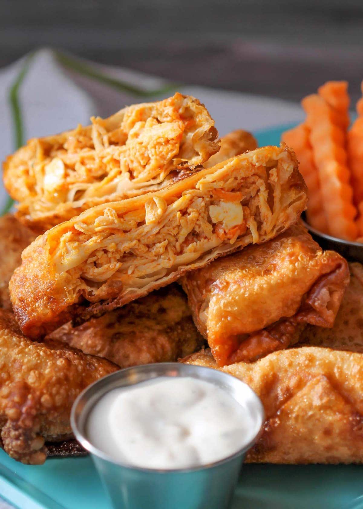 Close up of inside of Buffalo Chicken Egg Rolls with ranch dip