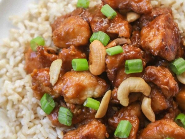 crockpot cashew chicken over rice on plate