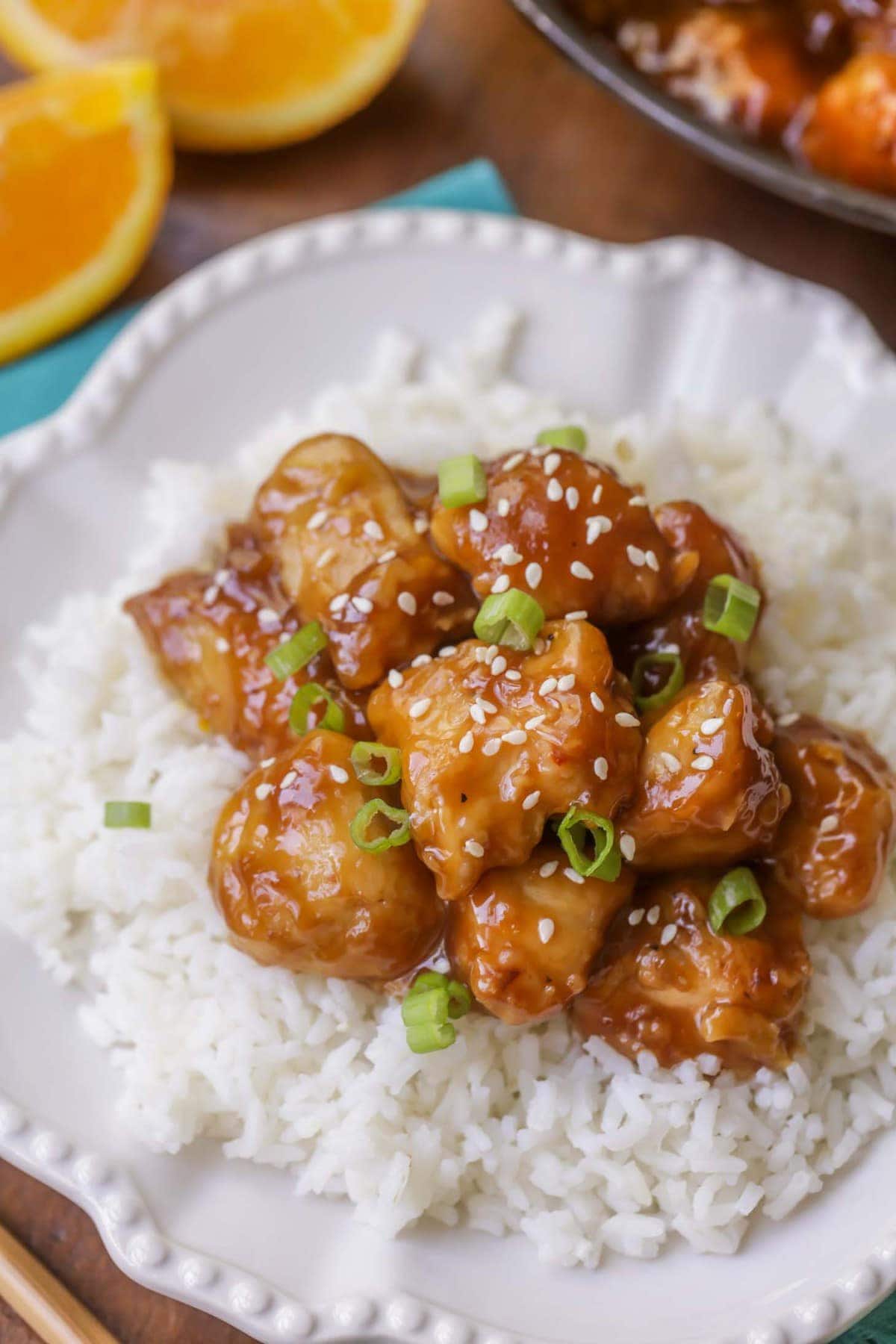 Copycat Panda Express Orange Chicken on plate with rice.