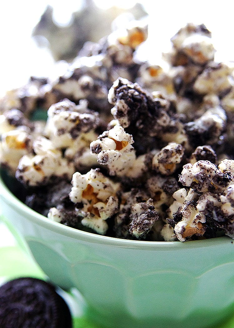 close up of cookies and cream popcorn in a mint bowl