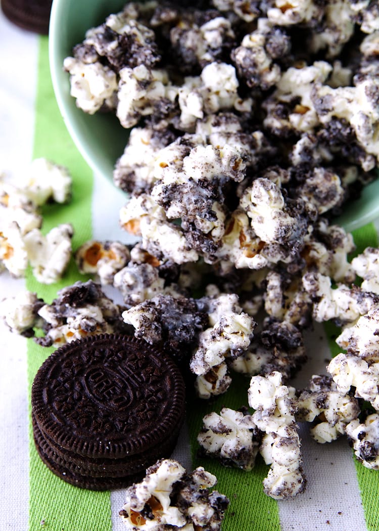 Cookies and Cream Popcorn spilling from a mint bowl