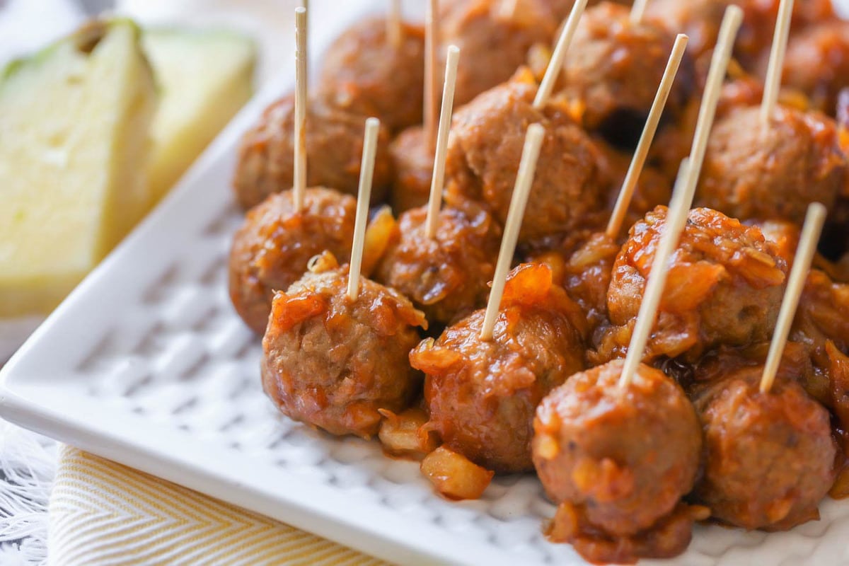 Thanksgiving appetizers - barbecue pineapple meatballs on toothpicks.