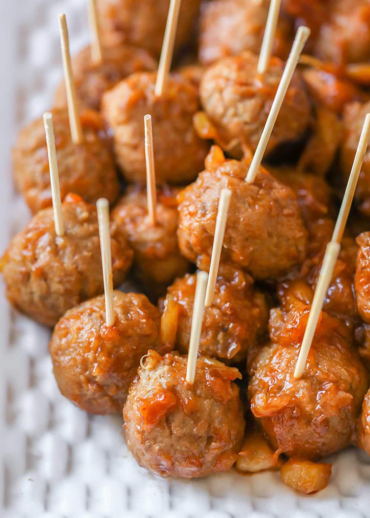 Close up of Barbecue pineapple Meatballs served on a white plate.