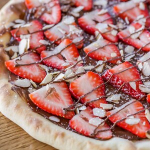 Homemade strawberry nutella pizza on counter.