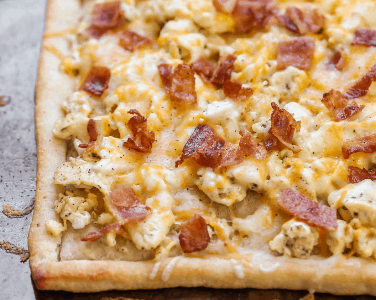 Breakfast Pizza with Bacon, eggs and cheese on top.