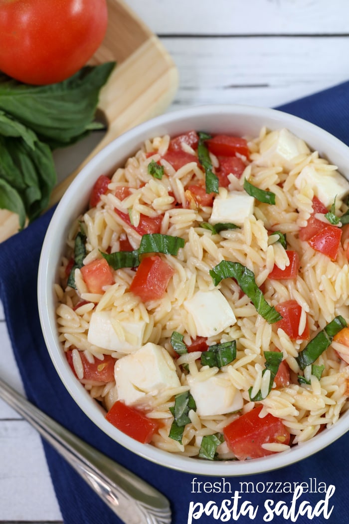 Fresh Mozzarella Pasta Salad - a light and delicious salad filled with orzo, fresh mozzarella cubes, tomatoes and basil. Definitely a new favorite and so simple!