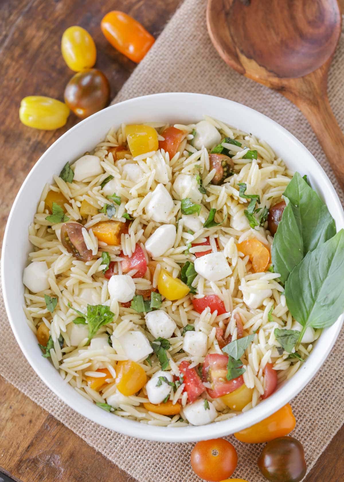 Fresh mozzarella pasta salad served in a white bowl.