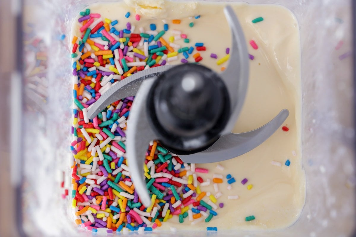 Ingredients for cake batter Milkshake and sprinkles in blender