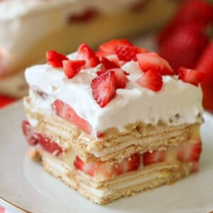 slice of strawberry shortcake lasagna on white plate