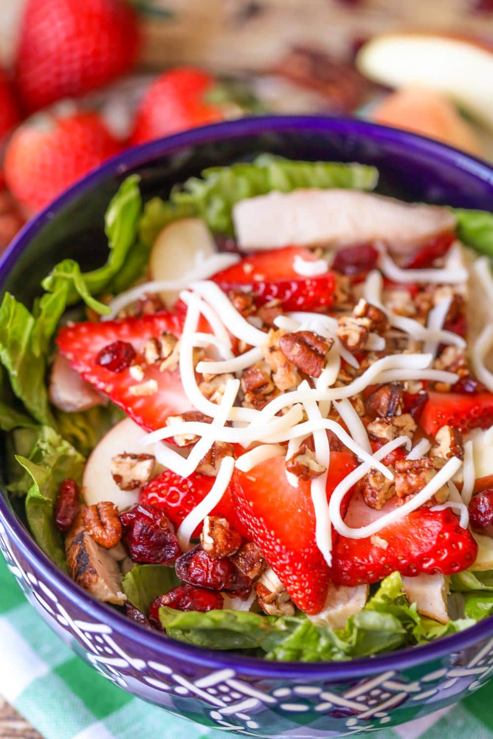 Strawberry salad served in a blue bowl.