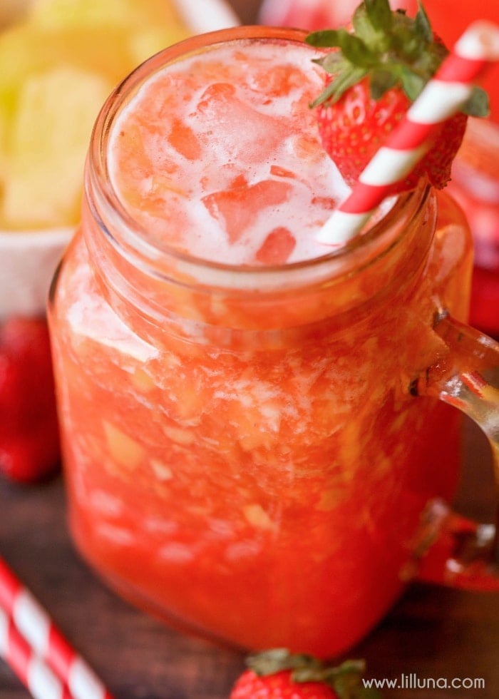 4th of July Drinks - Strawberry lemonade in a glass mug with a straw.