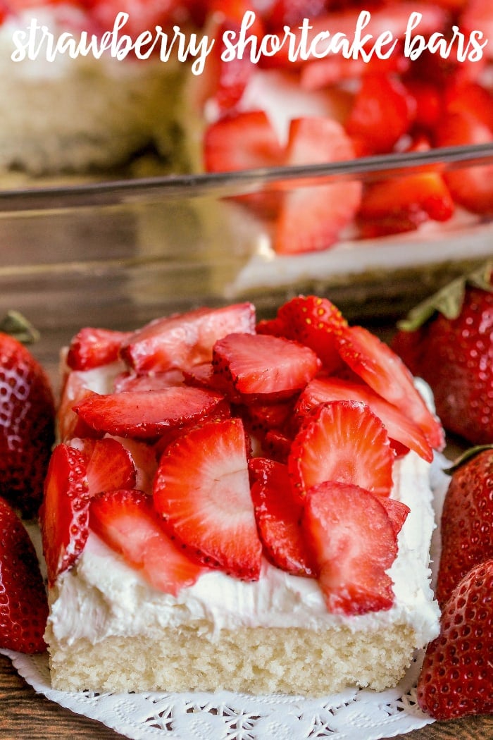 Strawberry Shortcake Bars - super soft cake like crust perfectly combines with a light layer of cream cheese and whipped cream, topped with fresh cold strawberries.