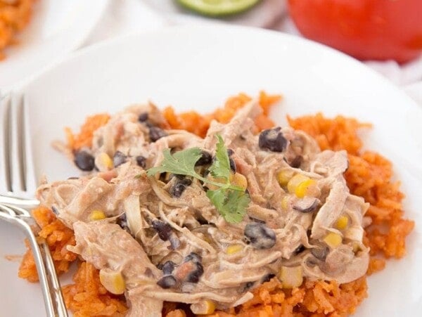 fiesta chicken over rice on white plate