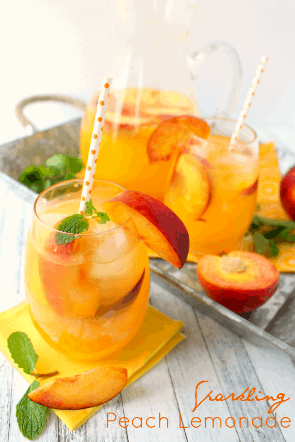 The perfect cold drink for sipping on a hot summer day! This delicious Sparkling Peach Lemonade is made with just a few simple ingredients and comes together in just minutes. Fantastic for picnics, parties and showers, too!
