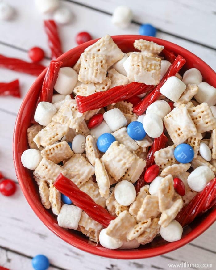 candy coated cereal mixed with mini marshmallows, licorice and M&Ms in a red bowl