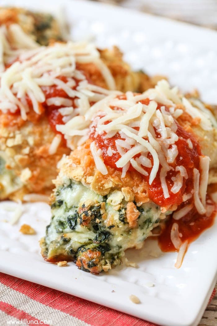 Chicken Parm roll ups on a white platter