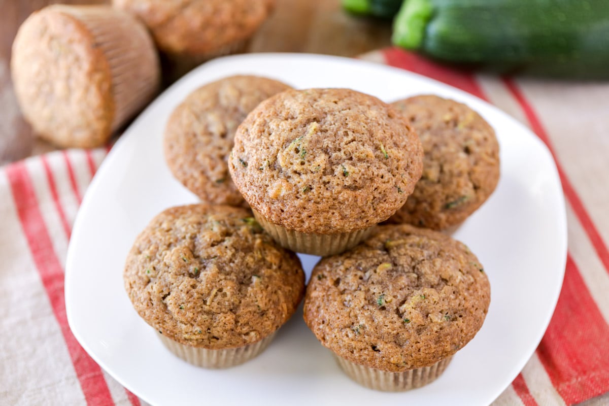 Easy zucchini muffins stacked on plate