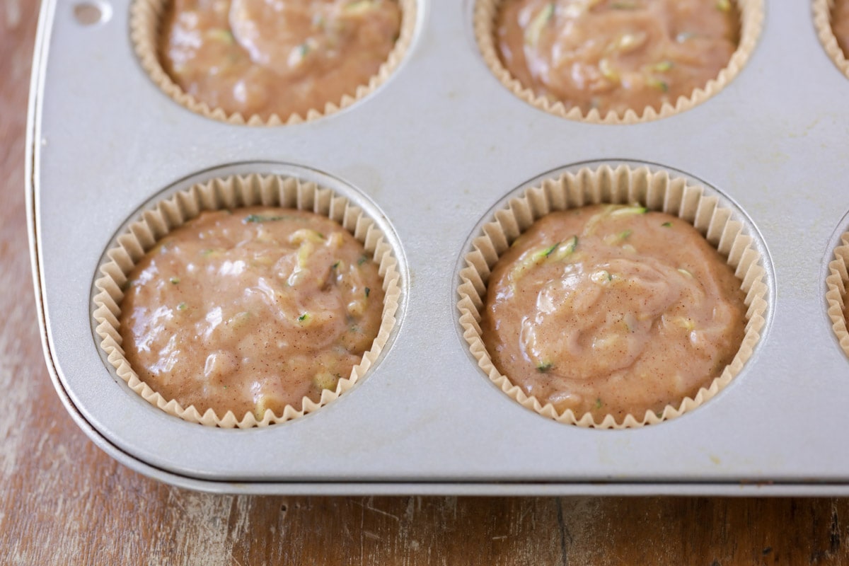 Zucchini muffins batter in muffin tins