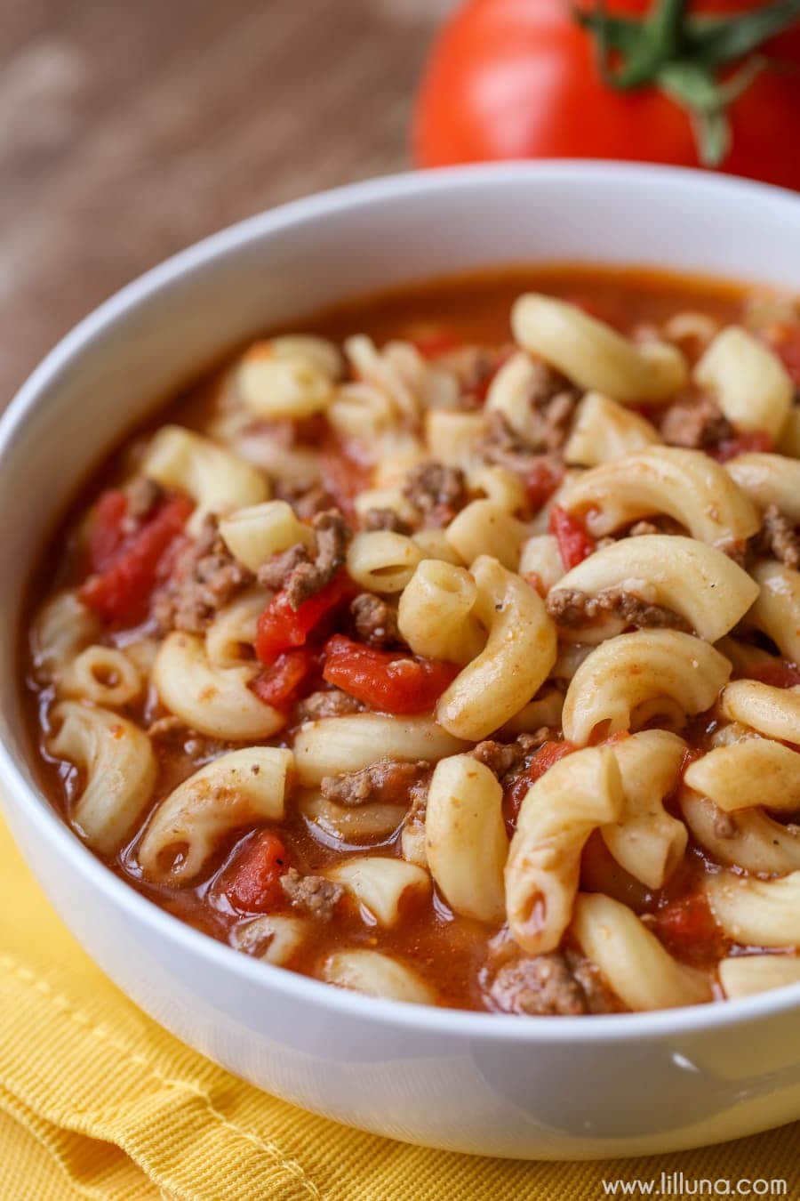 Easy soup recipes - beef and tomato macaroni soup in a white bowl.