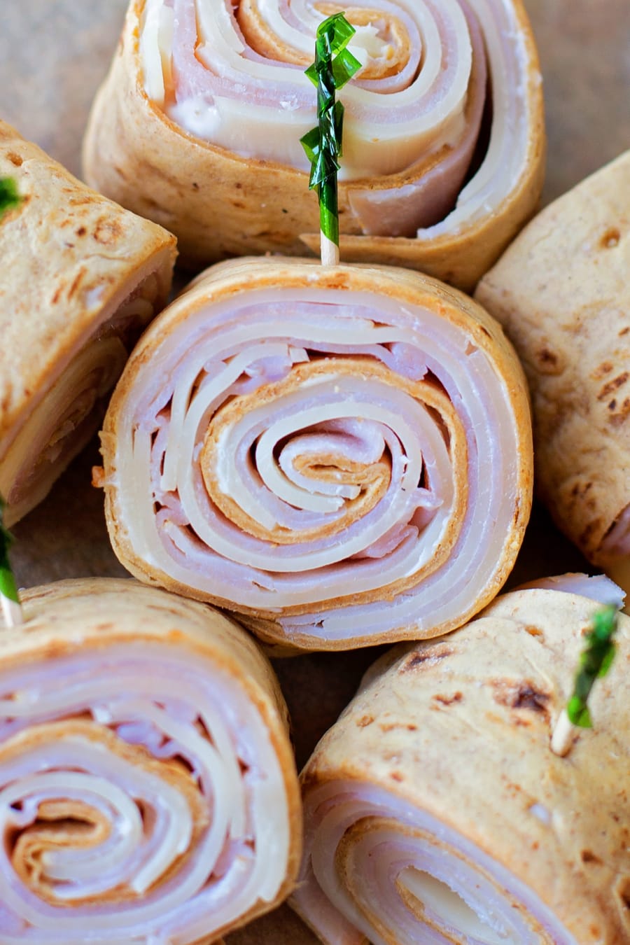Ham and Swiss Flatbread Pinwheels rolled and stacked