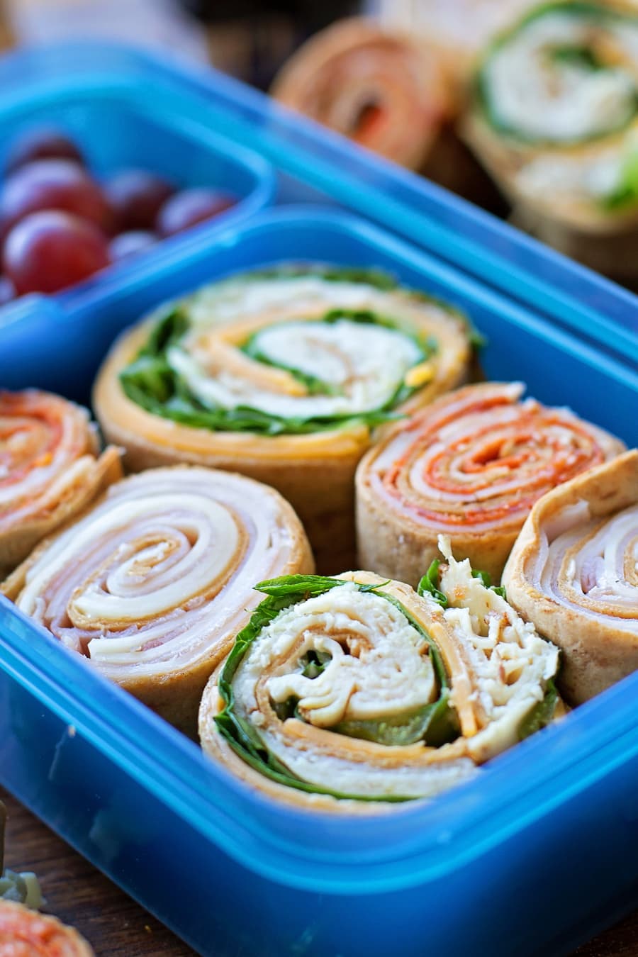 rolled flatbread pinwheels in a lunch container