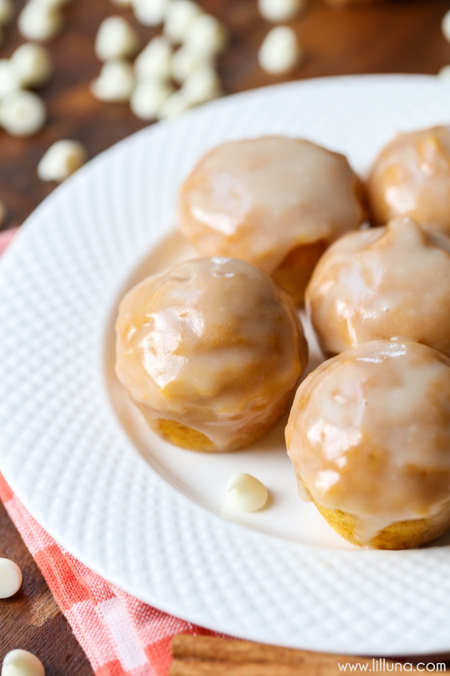 glazed pumpkin muffins on a white plate