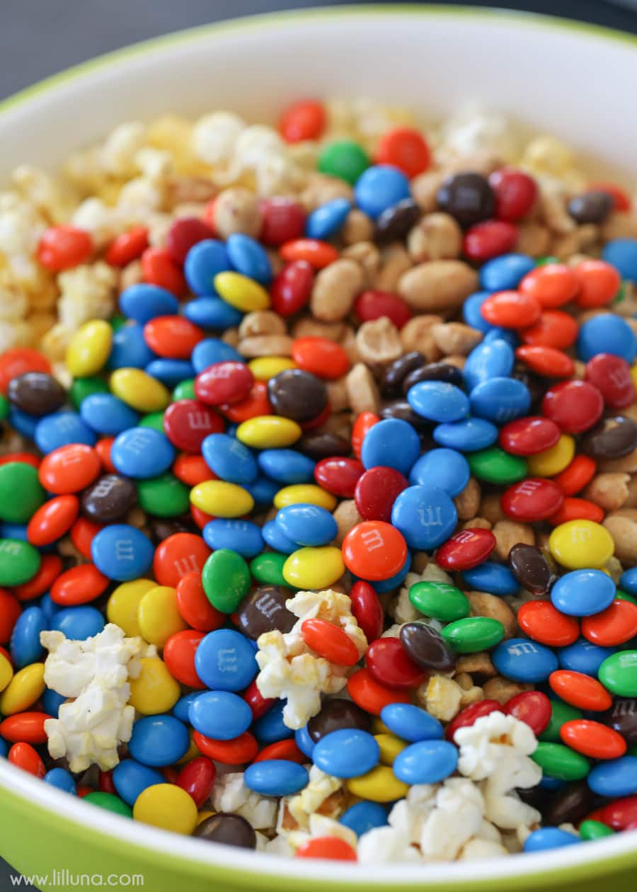 popcorn and M&Ms in a green bowl