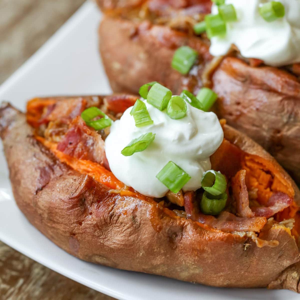 Quick dinner ideas - pork stuffed sweet potatoes topped with sour cream.
